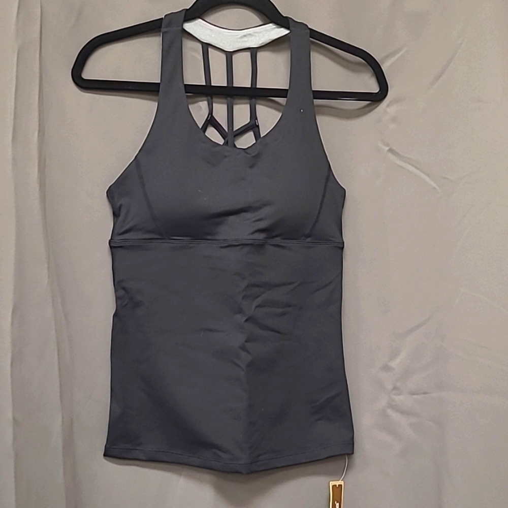OALKA size Medium exercise tank top.  Black in color, cross straps In Back.